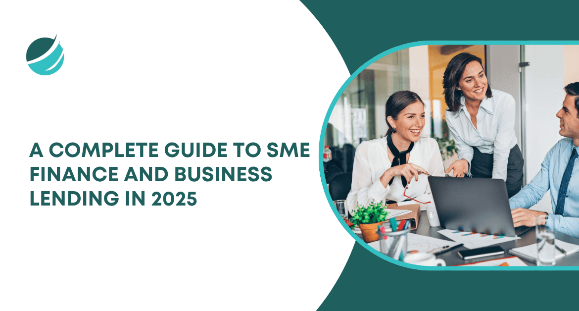 Business team collaborating at a desk with laptops, representing a complete guide to SME finance and business lending in 2025.
